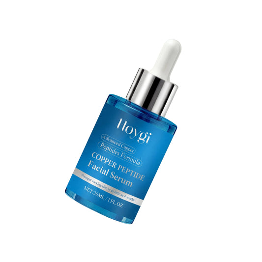 Blue facial serum bottle with dropper on a light gray background