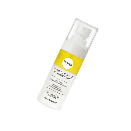 Skincare bottle with yellow label on a gray background